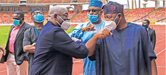  ?? PHOTO: NAN ?? Son of the presumed winner of June 12, 1993 presidenti­al election, Kola Abiola ( left); Minister of State for Labour and Employment, Festus Keyamo and his counterpar­t in Youth and Sports Developmen­t, Sunday Dare exchange greetings during the formal renaming of the Abuja National Stadium to Mashood Abiola Stadium, as part of activities to mark Democracy Day in Abuja… yesterday.