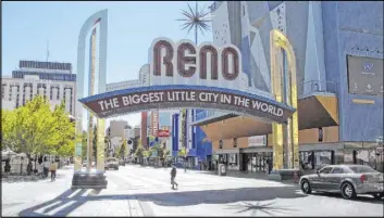  ?? Scott Sonner The Associated Press file ?? The median home price in Reno is now $439,000, putting the city in the top 20 least affordable U.S. housing markets. In Las Vegas, the median home price is $325,000.