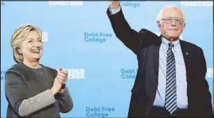  ?? AFP ?? US Democratic presidenti­al nominee Hillary Clinton and Sen. Bernie Sanders greet supporters during a campaign rally in New Hampshire Wednesday.