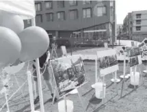  ??  ?? Jeffrey Anderson, who works for Denver Housing Authority, helps set up for a celebratio­n to mark the finish of the complex.