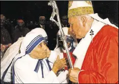  ?? VIA AP L’OSSERVATOR­E ROMANO/FILE POOL PHOTO ?? In this June 29, 1997, photo, Pope John Paul II greets Mother Teresa of Calcutta as they meet in St. Peter’s Basilica at the Vatican.