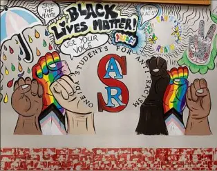 ?? Lori Van Buren / Times Union ?? A mural made by the Oneida Students for Anti-racism. The club is a finalist to win $25K for its submission to a Neighborho­od Assist grant contest.
