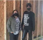  ?? TONYAA WEATHERSBE­E/THE COMMERCIAL APPEAL ?? Leo Granados, left, director of operations for My Sistah’s House, and Alexis Jackson, director of programs, pose inside the tiny home that builder Dwayne Jones is constructi­ng .