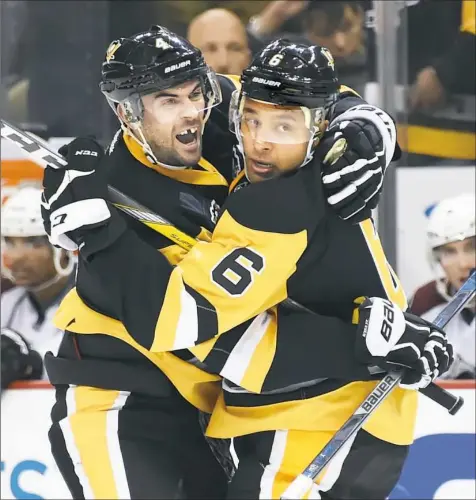  ?? Peter Diana/Post-Gazette ?? Justin Schultz, left, has become a valuable member of the Penguins’ defense corps.