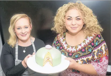  ?? MITCH MACDONALD/THE GUARDIAN ?? Chelsea Willis, left, of Butter Bakery and Chef Ilona Daniel show their finished Swedish Princess Cake. The recipe was developed in 1948 by a tutor to three Swedish princesses, and the popularity of the confection quickly swept the nation.
