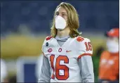  ?? MATT CASHORE, POOL — THE ASSOCIATED PRESS, FILE ?? Clemson quarterbac­k Trevor Lawrence watches players warm up prior to a Nov. 7 game against Notre Dame in South Bend, Ind.