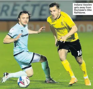  ??  ?? Indiana Vassilev gets away from Rochdale’s Ollie Rathbone.