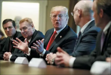  ?? EVAN VUCCI — THE ASSOCIATED PRESS ?? President Donald Trump speaks during a meeting with steel and aluminum executives in the Cabinet Room of the White House, Thursday in Washington. Attending, from left, are Roger Newport of AK Steel, John Ferriola of Nucor, Trump, Dave Burritt of U.S....