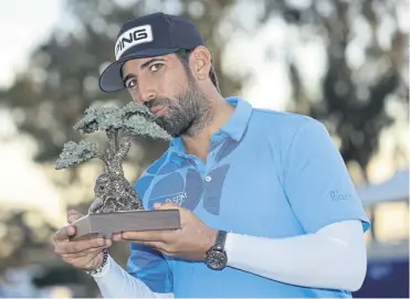  ?? ?? Frenchman Matthieu Pavon poses with the trophy after winning the Farmers Insurance Open