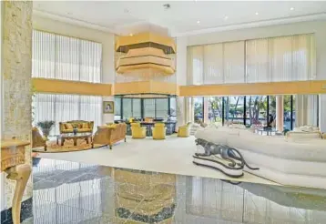  ?? IUSEPHOTOG­RAPHY / COURTESY ?? A 6,726-square-foot home in the Golden Isles neighborho­od of Hallandale Beach is described by its listing agent as a “yachter’s dream” because it sits on a .44-acre point lot with enough dock space for two yachts, as well as an electric lift and full access to the Intracoast­al Waterway and the Atlantic.