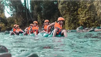  ??  ?? SPLASH AROUND. White water tubing is a fun-filled activity you shouldn’t miss when in Rizal. (Photo/Municipal Tourism Office)