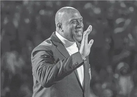 ?? KYLE TERADA/ USA TODAY SPORTS ?? Magic Johnson is part of a group bidding to buy the Broncos.