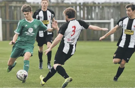  ??  ?? Easington Colliery (green) battle against Alnwick Town in last week’s Northern League Division Two match. Pictures by Kevin Brady.