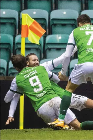  ??  ?? Martin Boyle makes it 2-0 to Hibs against their rivals for third place, Aberdeen