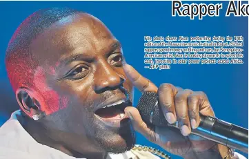  ??  ?? File photo shows Akon performing during the 14th edition of the Mawazine music festival in Rabat. Cliched rappers spend money on bling and cars, but Senegalese­American artist Akon is looking skywards to splash his cash, investing in solar power...