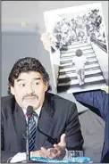  ??  ?? Football legend Argentinia­n Diego Maradona speaks as a picture showing his arrival in Naples in 1984 made by photograph­er Luciano Ferrara is displayed during a press conference on Feb 26, in Naples. Maradona, who rarely stepped foot in Italy since...