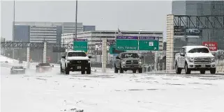  ?? Yi-Chin Lee / Staff photograph­er ?? Vehicles drive last Monday on snow-covered Interstate 10 in Houston. Two days later, Pablo Pedraza set out on the 197-mile journey to deliver lifesaving medicine to a San Antonio girl’s family.