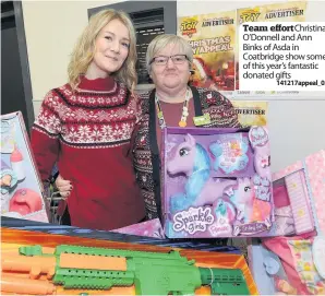  ?? 141217appe­al_02 ?? Team effort Christina O’Donnell and Ann Binks of Asda in Coatbridge show some of this year’s fantastic donated gifts