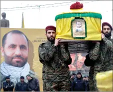  ?? — AFP photo ?? Hezbollah militants and supporters attend the funeral of Ali alDebs, killed by an Israeli air raid two days earlier, in Lebanon’s southern city of Nabatieyh.