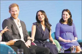  ??  ?? From left, Britain's Prince Harry, Meghan Markle and Kate, Duchess of Cambridge during the first Royal Foundation Forum in London on Wednesday.