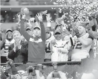  ?? ROGER STEINMAN/AP ?? center, celebrates after the Sooners beat Texas in the Big 12 championsh­ip game.