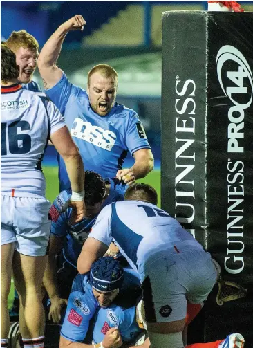  ??  ?? James Ratti goes over for the Blues’ bonus point try at the Arms Park last night