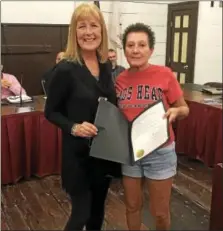  ??  ?? Left, Lisa Reilly, Kutztown Pool Co-Manager, with Kutztown Mayor Sandy Green during the September Kutztown Borough Council meeting. Reilly was honored for her actions that saved a boy at Kutztown Pool.