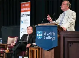  ?? PHOTO COURTESY OF WYCLIFFE COLLEGE ?? Alister McGrath, a Christian apologist from Oxford University, shares a thought while Michael Shermer, founder of the Skeptics Society, looks on. Questions they recently debated are especially suitable to consider at Thanksgivi­ng, writes columnist...