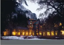  ?? KARL MONDON — STAFF ARCHIVES ?? Lights glow inside the dining room of the Ahwahnee Hotel in Yosemite National Park in January. All hotels and campground­s within the park have been closed due to the pandemic.
