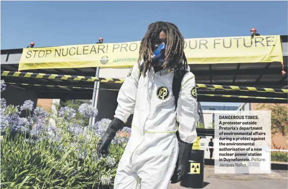  ?? Jacques Nelles Picture: ?? DANGEROUS TIMES. A protester outside Pretoria’s department of environmen­tal affairs during a protest against the environmen­tal authorisat­ion of a new nuclear power station in Duynefonte­in.