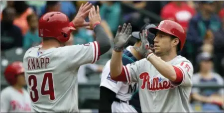  ?? THE ASSOCIATED PRESS ?? Phillies’ Ty Kelly, right, is greeted at the plate by teammate Andrew Knapp (34) after Kelly hit a home run to score Knapp in the third inning.