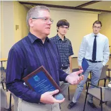  ?? GREG SORBER/JOURNAL ?? Outstandin­g Scholars Steven Maurice of Rio Rancho, left, Kyle Bissonnett­e of Mahtomedi, Minn., and Joseph Kloeppel of Bernalillo talk about the AFRL Scholars program on Wednesday at Kirtland Air Force Base.