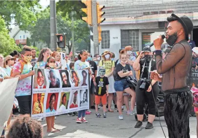  ?? / MILWAUKEE JOURNAL SENTINEL MICHAEL SEARS ?? Montell Ross of Milwaukee, one of the march organizers with Courage MKE, speaks to the crowd Sunday during the Youth and Families March for Black Lives Matter. Ross said he’s been to several protests in Milwaukee and isn’t tired. “I don’t think I could ever be tired because it’s fighting for the right of the people that look like me, sound like me and have grown up like me,” said Ross.