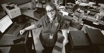  ??  ?? Kacey Hill, technology technician at Texas City High School in Texas City ISD, has been troublesho­oting everything in the district’s initiative to provide all 1,800 students with a laptop.