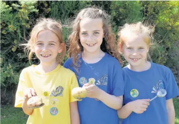  ??  ?? Skills Pictured after their potato and spoon race are P3A girls (from left) Lily Donald (first), Cailyn Buick (second) and Sara Markova (third)