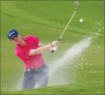  ?? Associated Press photo ?? Justin Thomas hits from the bunker on the 18th hole during the final round of the PGA Championsh­ip golf tournament at the Quail Hollow Club Sunday in Charlotte, N.C.