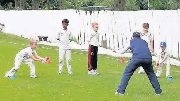  ??  ?? ●● Youngsters taking part in the Big Coach and Fundraisin­g day at Macclesfie­ld Cricket Club. See page 71