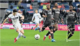  ??  ?? Flying: Daniel James scores Swansea’s second goal after an 84-yard run