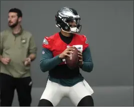  ?? MATT SLOCUM — THE ASSOCIATED PRESS ?? The Philadelph­ia Eagles' Jalen Hurts runs a drill during practice at the team's training facility Friday, in Philadelph­ia.