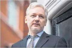  ?? AFP ?? WikiLeaks founder Julian Assange addresses the media in 2016 from the balcony of the Ecuadorean embassy in central London.