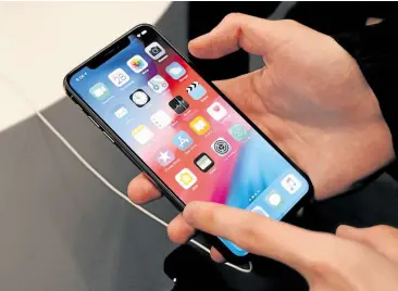  ?? —REUTERS ?? WINNERS AND LOSER iPhone maker Apple has registered its concerns over a European Commission proposal for the bloc to adopt a standard charging port for smartphone­s, but the EC considers the move a win for consumers.