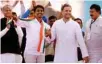  ?? - PTI ?? ELATED: Congress vice-president Rahul Gandhi with the OBC leader Alpesh Thakor who joined the party, during a public meeting in Gandhinaga­r, Gujarat on Monday.