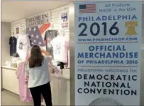  ?? CHEN WEIHUA / CHINA DAILY ?? The store inside the Comcast Center in Philadelph­ia sells only 2016 DNC souvenirs, and the huge sign outside the door says all products are made in the US. Anti-trade sentiment has been strong during the 2016 Democratic National Convention, being held...