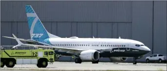  ?? ELAINE THOMPSON — THE ASSOCIATED PRESS ?? A Boeing 737 MAX jet taxis after landing at Boeing Field following a test flight in Seattle last June.