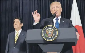  ?? AP PHOTO ?? President Donald Trump speaks as Japanese Prime Minister Shinzo Abe listens as they both made statements about North Korea at Mar-a-Lago in Palm Beach, Fla., Saturday. North Korea reportedly fired a ballistic missile early Sunday in what would be its...