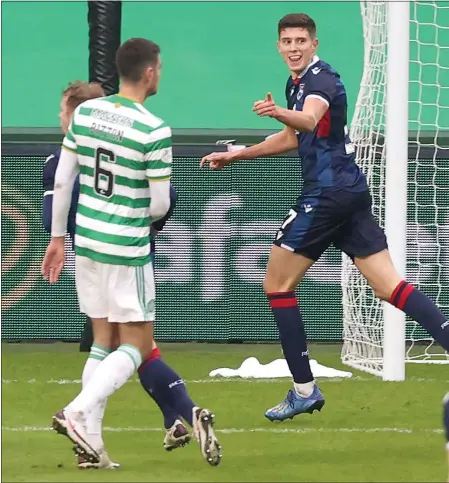  ??  ?? Ross Stewart celebrates scoring the penalty which gave Ross County the lead at Parkhead
