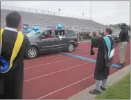  ?? DAN SOKIL — MEDIANEWS GROUP ?? North Penn school board member Tim MacBain gives two thumbs up and fellow board member Jonathan Kassa applauds for a graduating class of 2020senior during a virtual graduation ceremony at the high school’s Crawford Stadium.