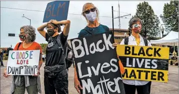  ?? KEREM YUCEL/GETTY-AFP ?? Demonstrat­ors protest the police shooting of Jacob Blake in front of the Kenosha Courthouse on Tuesday in Wisconsin.