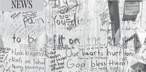  ?? PHOTOS: PETER J THOMPSON / NATIONAL POST ?? Personal notes of condolence are written on a wall on Yonge Street in Toronto for those killed and injured in Monday’s van rampage.