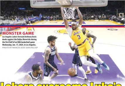  ?? PHOTO BY MARCIO JOSE SANCHEZ/AP ?? MONSTER GAME Los Angeles Lakers forward Anthony Davis dunks against the Dallas Mavericks during the first half of an NBA basketball game Wednesday, Jan. 17, 2024, in Los Angeles.